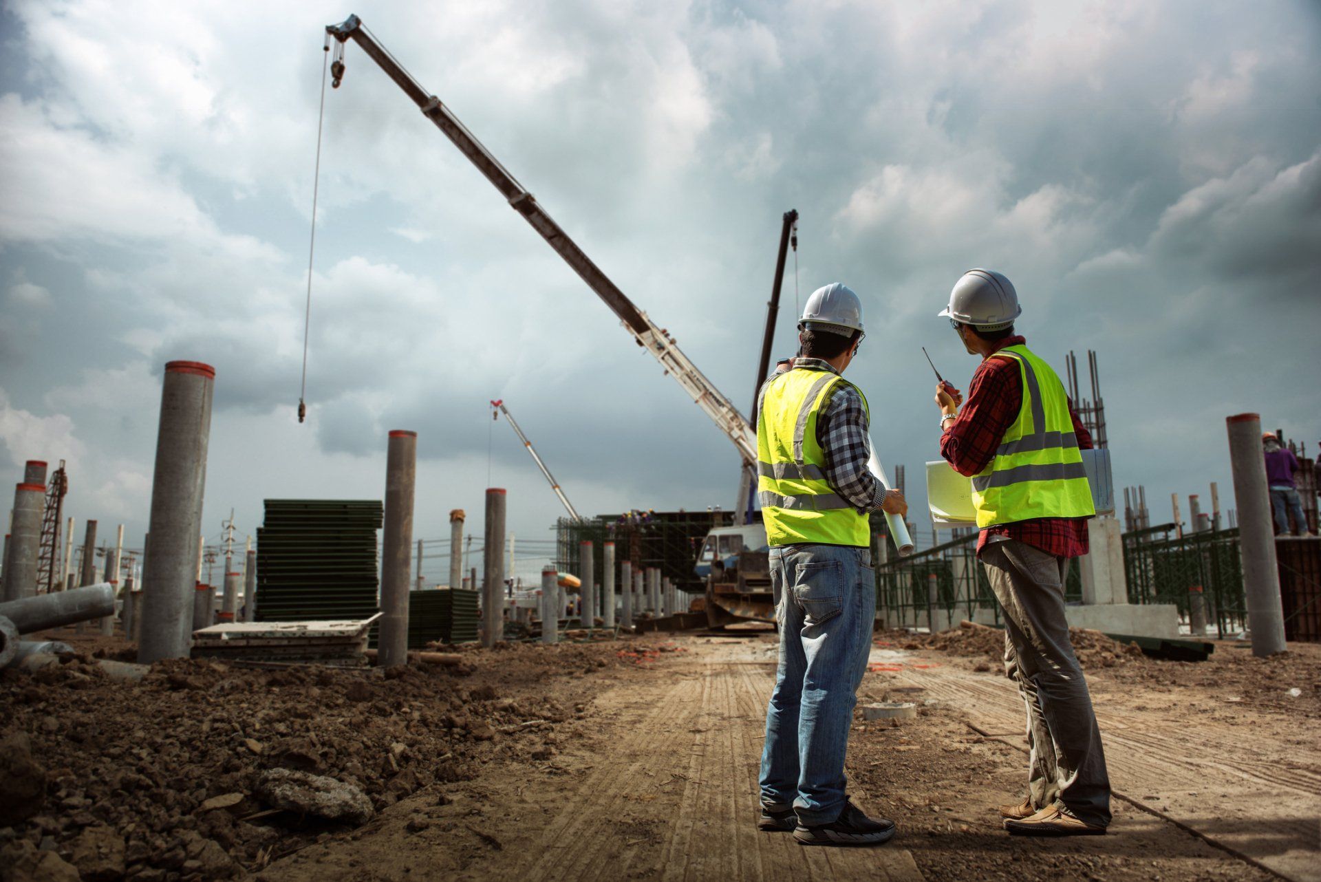 Contractors reviewing site plans at a job site served by Beartown Recycling