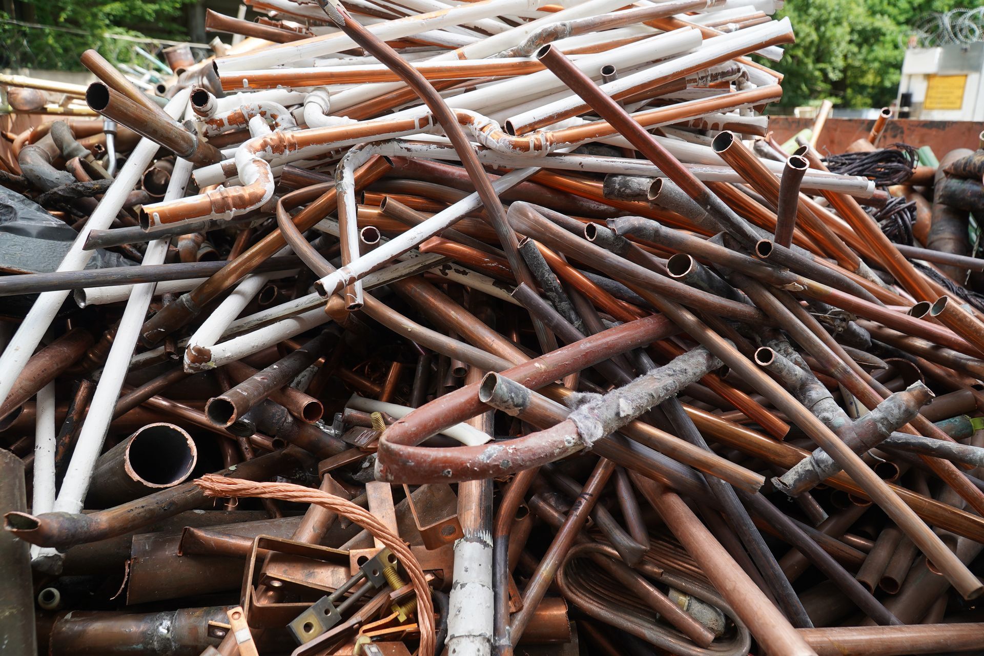 Mixed non-ferrous scrap pipes gathered in a recycling yard
