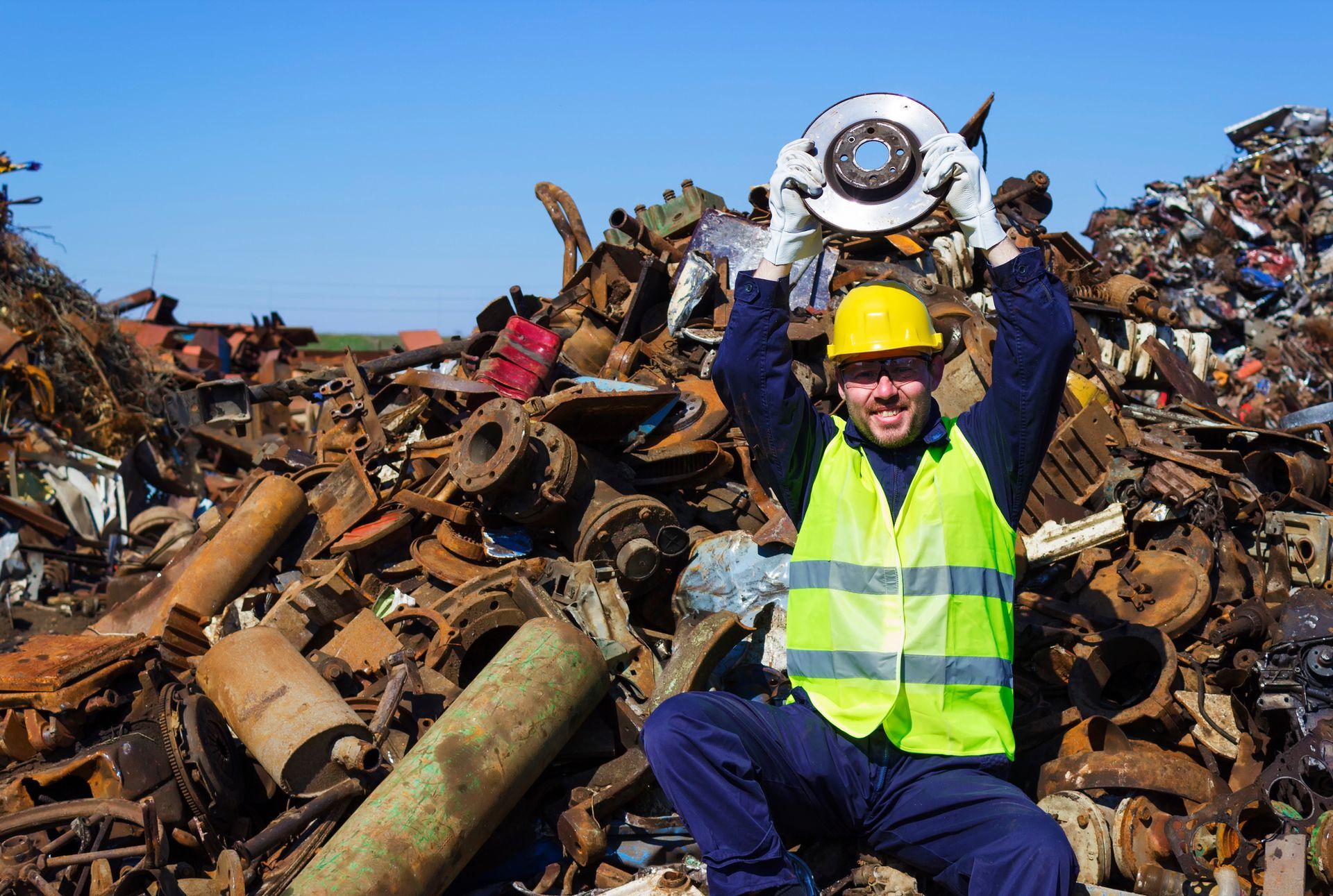 A Beartown Recycling worker examining incoming material at the plant